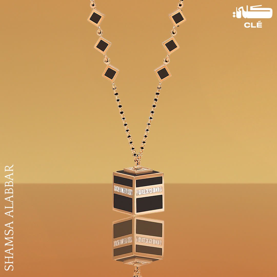 Luxury jewellery design: Rose gold cube pendant necklace with a reflection on gold